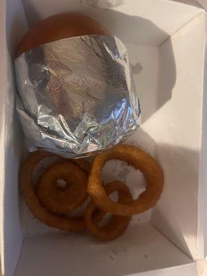 The burger and my sad 4 onion rings so disappointed this is unacceptable