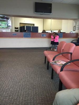 Reception area. Twin girls waiting.