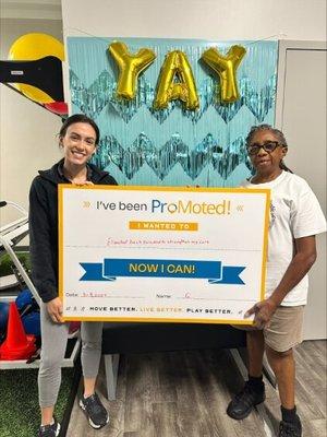 Lauren Celebrates with her patient with a Graduation Photo