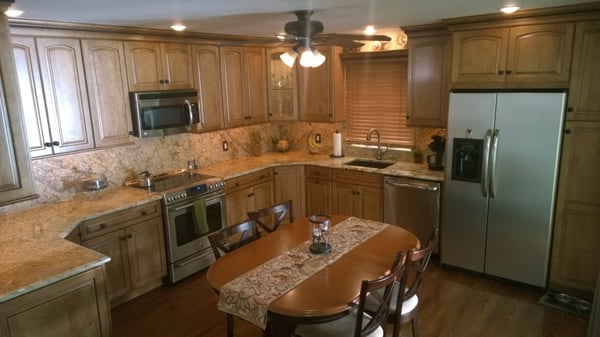 North Bellmore Kitchen with Granite tops and backsplash. The kitchen features a 2 foot bump out extension to add some more room.