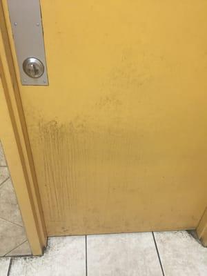 Door leaving the bathroom hasn't been cleaned either