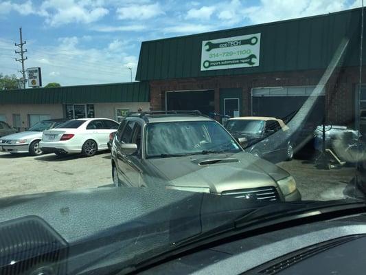 my coworker took this stalker pic of my car waiting in front of Ecotech to have timing belt and spark plugs changed. and lubed up of course