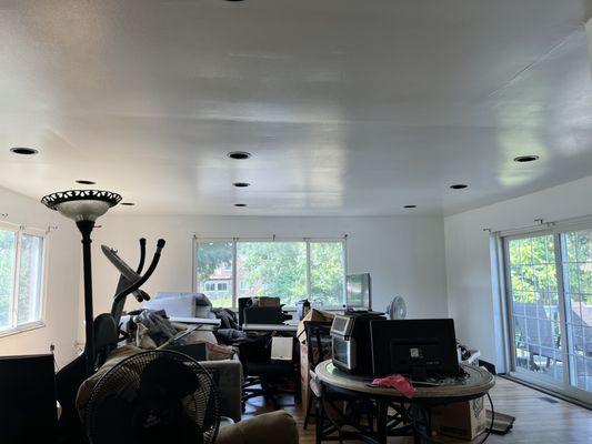 Full view of family room ceiling and walls painted white