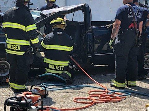 Fire truck training outside of Ash Automotive