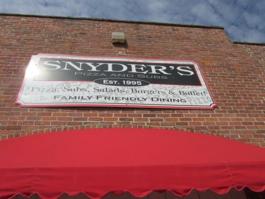 sign on outside wall for Snyders for subs etc.