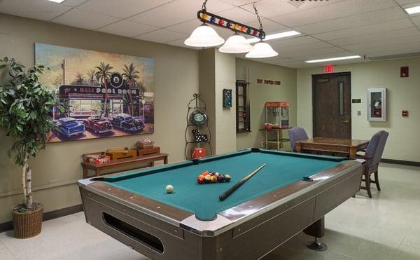 Recreation room featuring a pool table and popcorn machine.