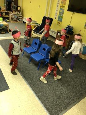 Our older class playing musical chairs at our Valentine's Day party