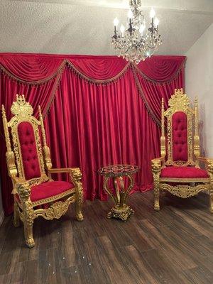 Red velvet drapes with red swags valance. As a finish touch we used gold and red beads trim.