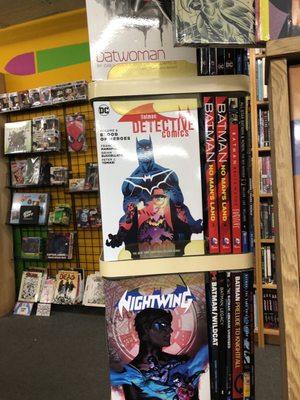 Various Batman graphic novels inside Speeding Bullet Comics