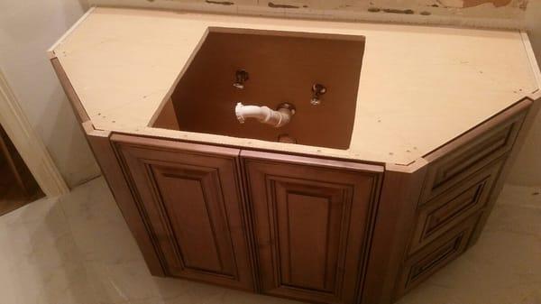 top of angled cabinet, before granite and sink install