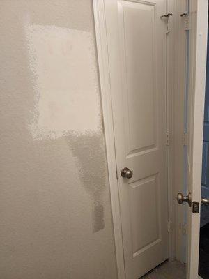 Damaged bathroom wall repair. Patched, sanded and painted to match color as best as possible