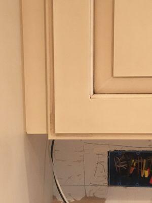 Door hung lower then cabinet