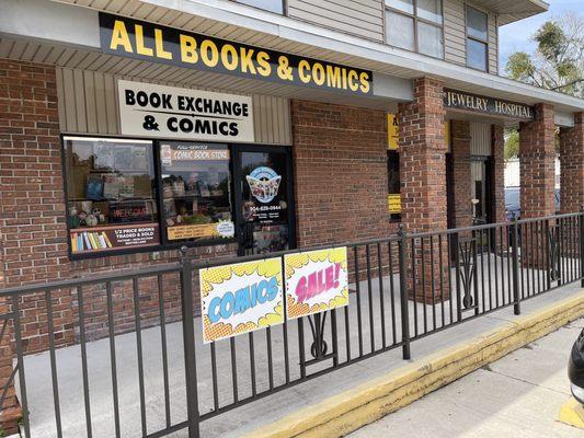 The exterior of All Books & Comics, which is across from Target and next to Ray's Tire.