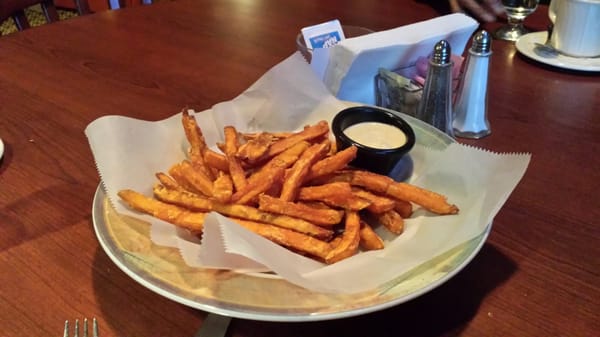 Sweet potato fries basket with cinnamon sugar and jalapeno lime dipping sauce