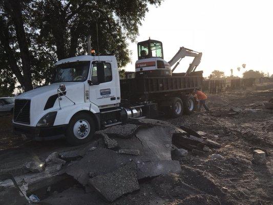 Roll off truck with excavator ready for your next project.