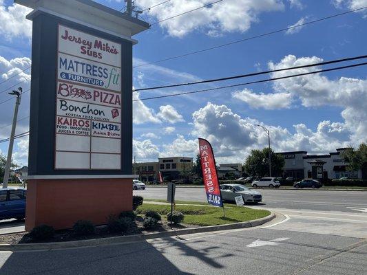 Sign for location Mattress Fit & Furniture signage