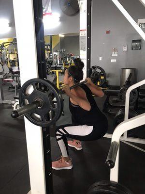 Client doing smith machine squats