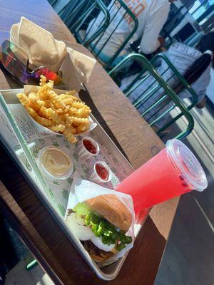 Cheese burger, fries and a dragonfruit drink.