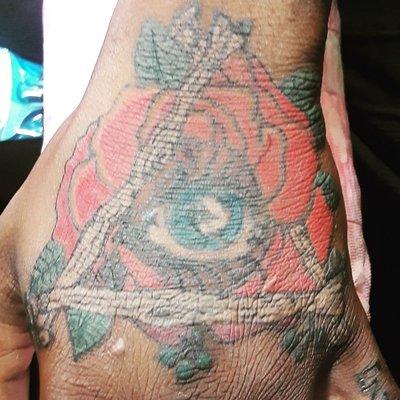 An all seeing eye with a rose done on darker skin tone, this is only the first pass and the client will need to return for a 2nd session