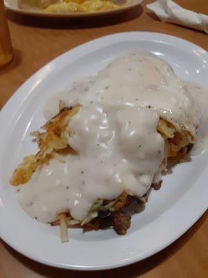 Opie's Breakfast $5.99 Biscuit, hashbrowns, egg sausage & gravy.