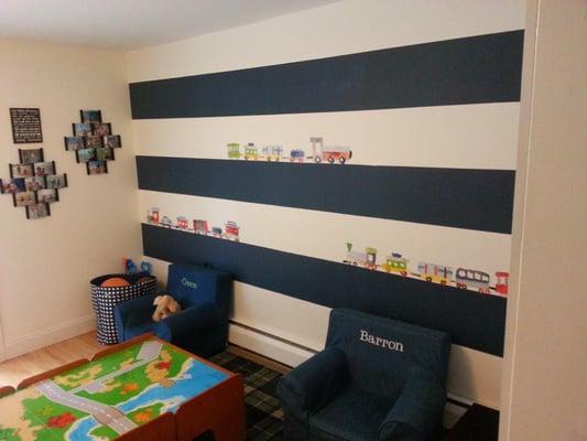 Painted walls and trim. Added horizontal stripes and wall decals