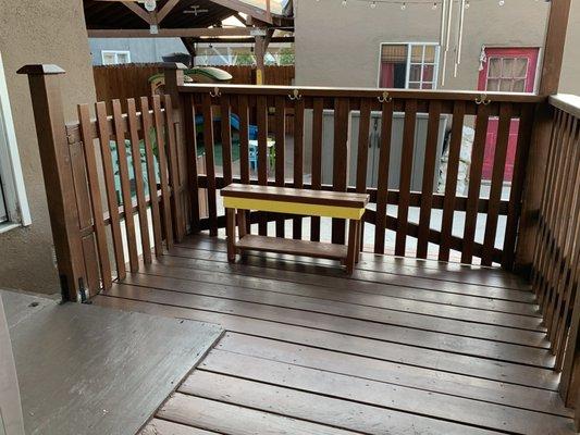 Deck area used to store their shoes under the bench and hang their belongings on the hooks.