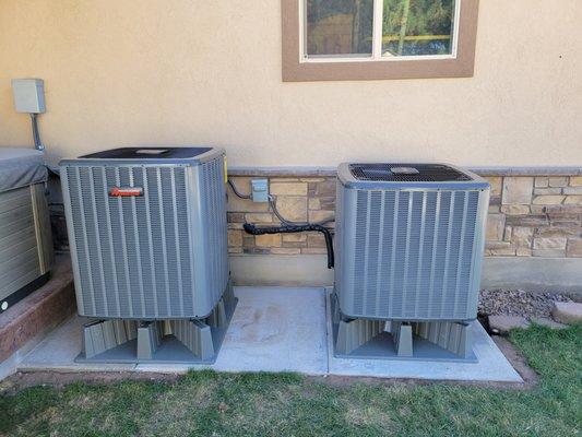 Two outdoor heat pump systems that we installed. 16 Seer Amana product and boy do they purr!