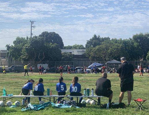 Coaches strategizing their plays.