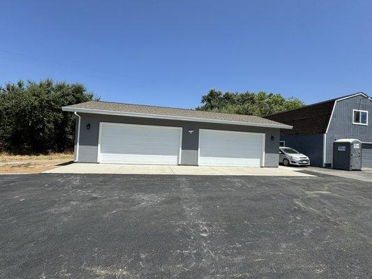 1100 four car garage with electric charger and epoxy floors and cabinets