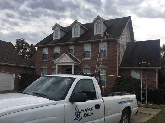 Preparing to softwash an asphalt shingle roof to get rid of black stains, moss, and lichen growing on the shingles