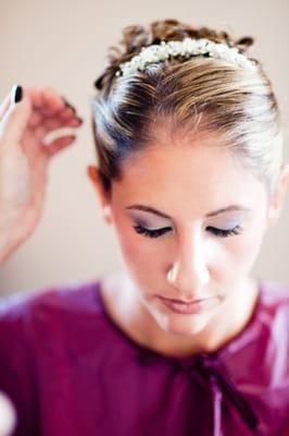 Detail shot of a bride as her hair is being done