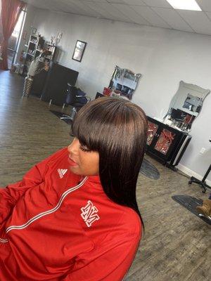 Traditional sew-in with bangs