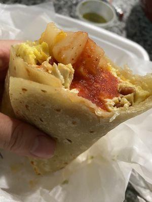 My favorite breakfast burrito and red salsa from here