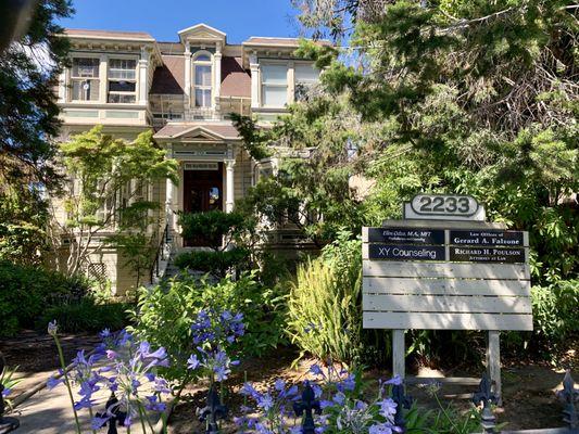 The outside of our office at the beautiful Mansard Building, 2233 Santa Clara Ave, Alameda.