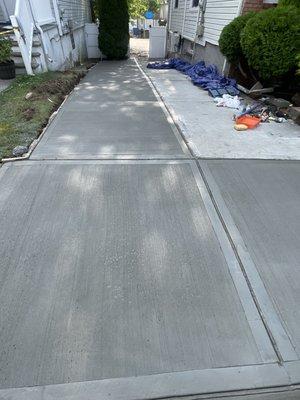 4000 PSI ready-mix concrete poured for 3 Car driveway.