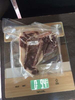 Actual packaging and weight of a cut of meat. The 0 is pounds and the right side number is ounces. A pound is 16 ounces.