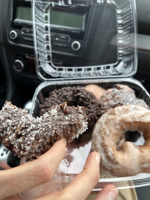 Clockwise from bottom left, coconut chocolate glaze, triple chocolate, blueberry fritter, sour cream.