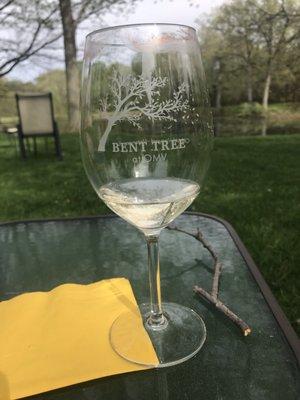 Having a delicious glass of paradise wine by OMV sitting at their peaceful pond.