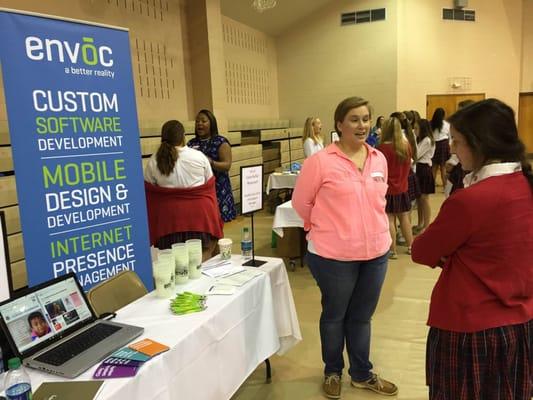 Our very own QA, Lizzie, is repping Envoc at the St. Joseph's Academy career day and talking to a young woman about careers in technology.