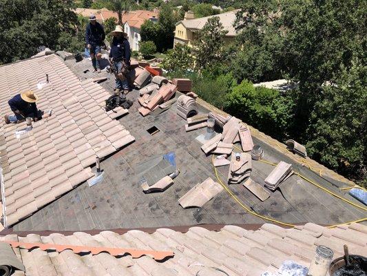 Replacement of tile roof underlayment.