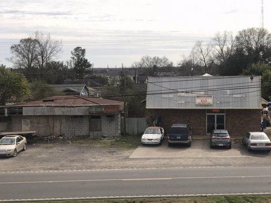 Don't let the shabby exterior fool you. It's to the left of a run down gas station.