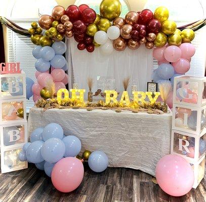 Custom themed party banner and balloon backdrops, with multi colored marquee letters