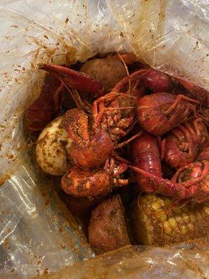 1 lb of Crawfish in Louisiana seasoning, potatoes corn and sausage with a garlic egg.