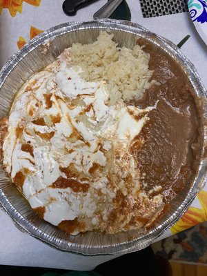 Steak enchiladas with rice and beans