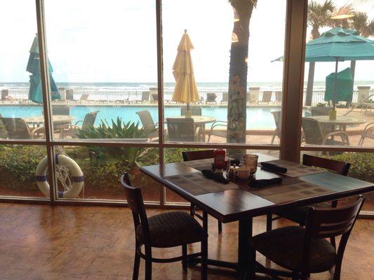 The dining area overlooks the hotel pool & Atlantic Ocean