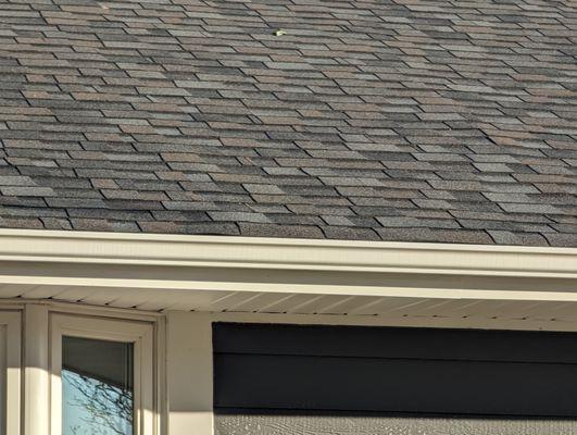 Owens Corning shingles in Williamsburg Gray and LP siding in Cavern Steel.