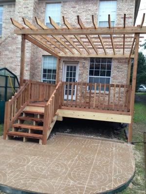 This is a deck and patio we built for a customer in Austin. Cedar deck and pergola, pre-cast cement pavers set on compacted r...