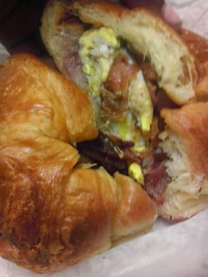 Bacon, egg with jelly on a croissant.