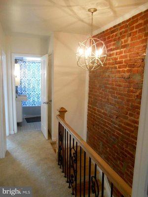 exposed brick wall in rowhouse