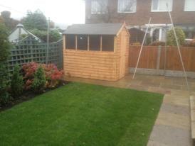 in this picture we did everything, the fence, paving, lawn and flower beds, even built the shed